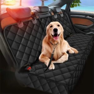 Dog car hammock fitted across the back seat of a car with a golden retriever sitting on it, headrest straps and seat belt opening visible
