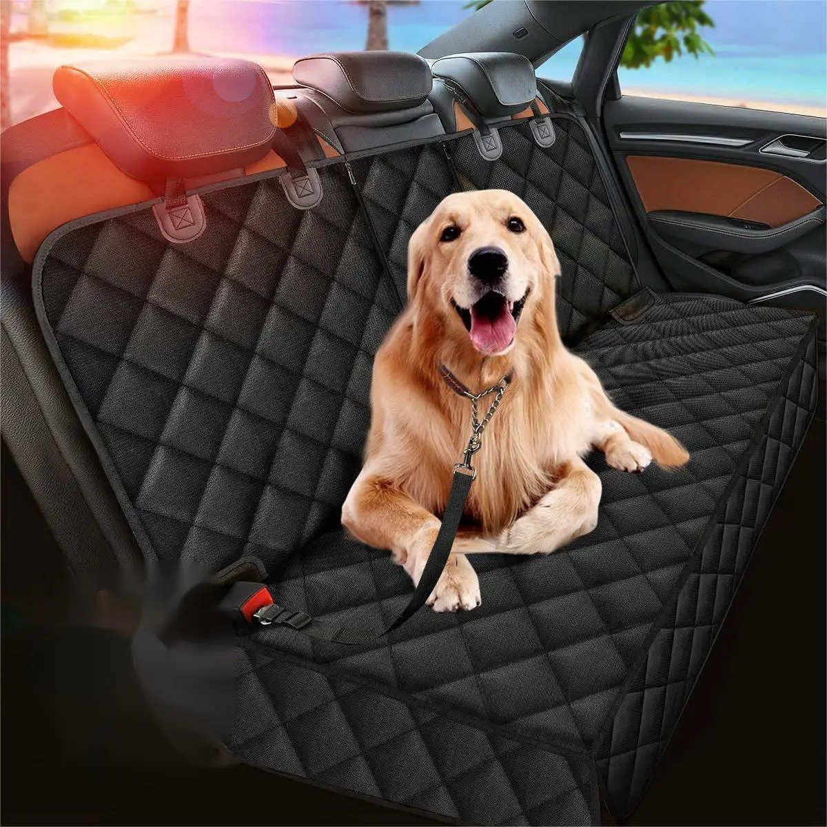 Dog car hammock fitted across the back seat of a car with a golden retriever sitting on it, headrest straps and seat belt opening visible
